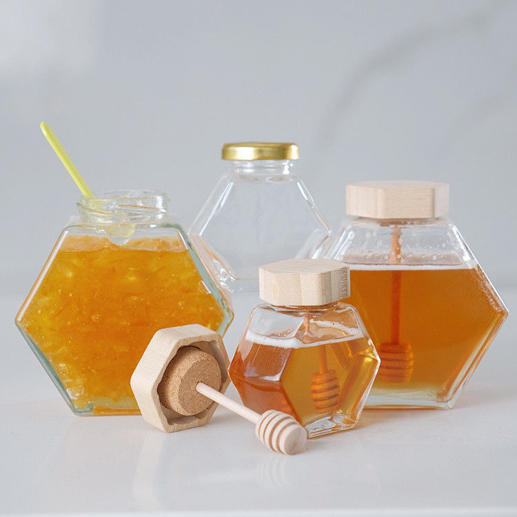 Hexagonal espessado Transparente armazenamento de alimentos de diferentes tamanhos frascos de vidro de mel com tampa de metal selada