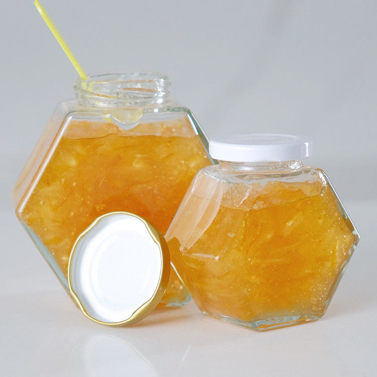 Hexagonal espessado Transparente armazenamento de alimentos de diferentes tamanhos frascos de vidro de mel com tampa de metal selada