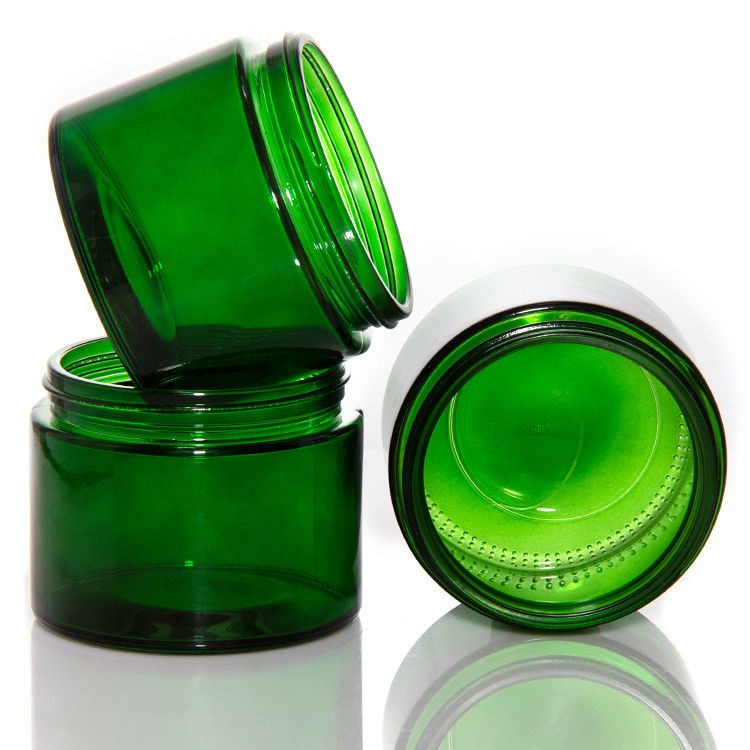 Jarros de velas de vidro transparente de cor verde vazia com tampa ODM