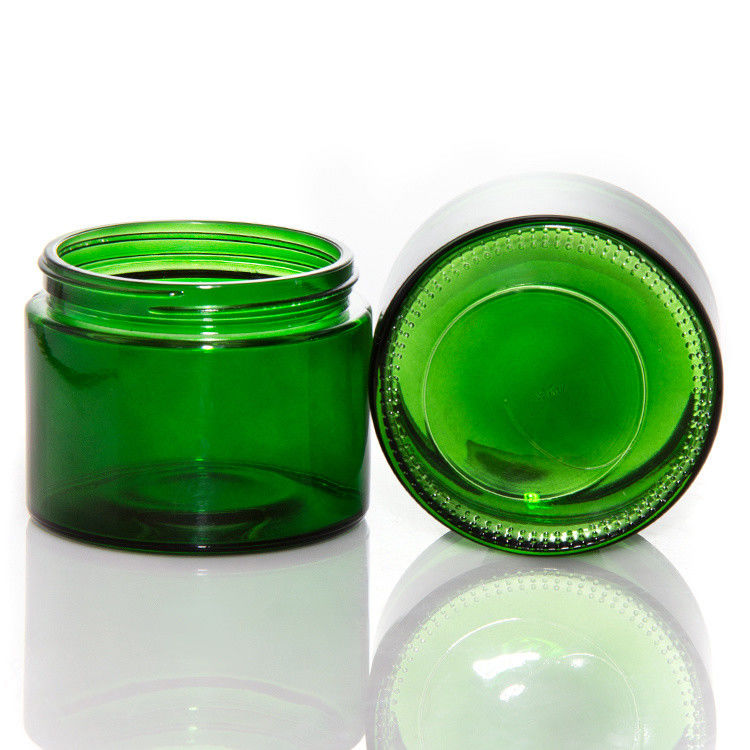 Jarros de velas de vidro transparente de cor verde vazia com tampa ODM