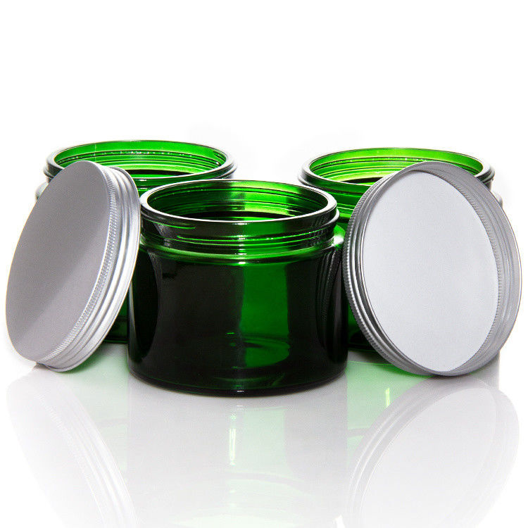 Jarros de velas de vidro transparente de cor verde vazia com tampa ODM